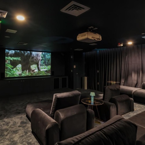 Access to resident-only features a room with a tv and couches