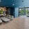 a room with a large glass wall and a large glass wall with a large rock wall and a
